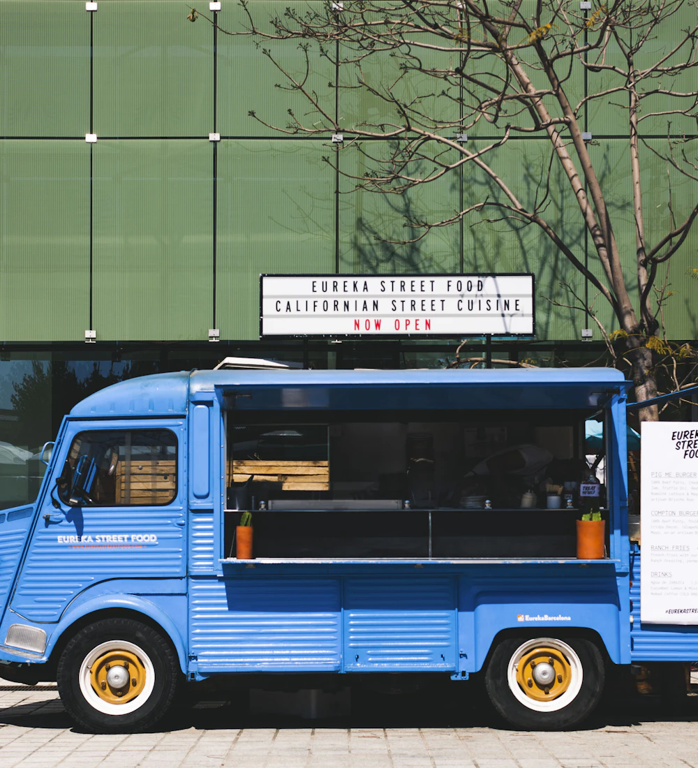 Rolling Comal, a fictional food truck — Tacos off the comal. Follow the blue truck.